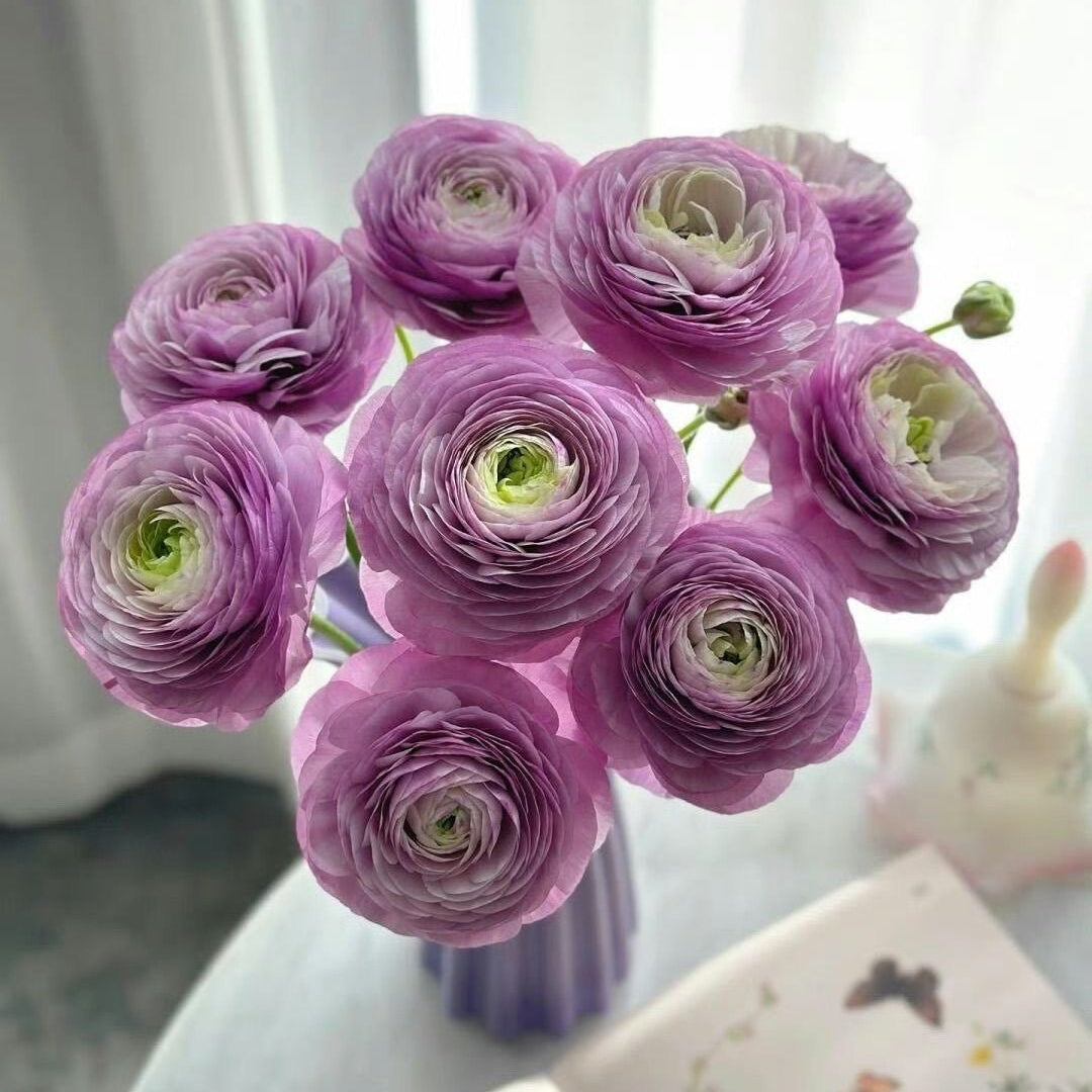Bouquet of purple flowers on a table with a blurred background